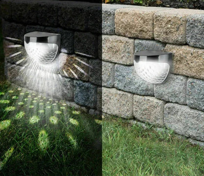 Applique murale solaire design moderne fixée sur un mur en pierre, illuminant le jardin avec un éclairage doux