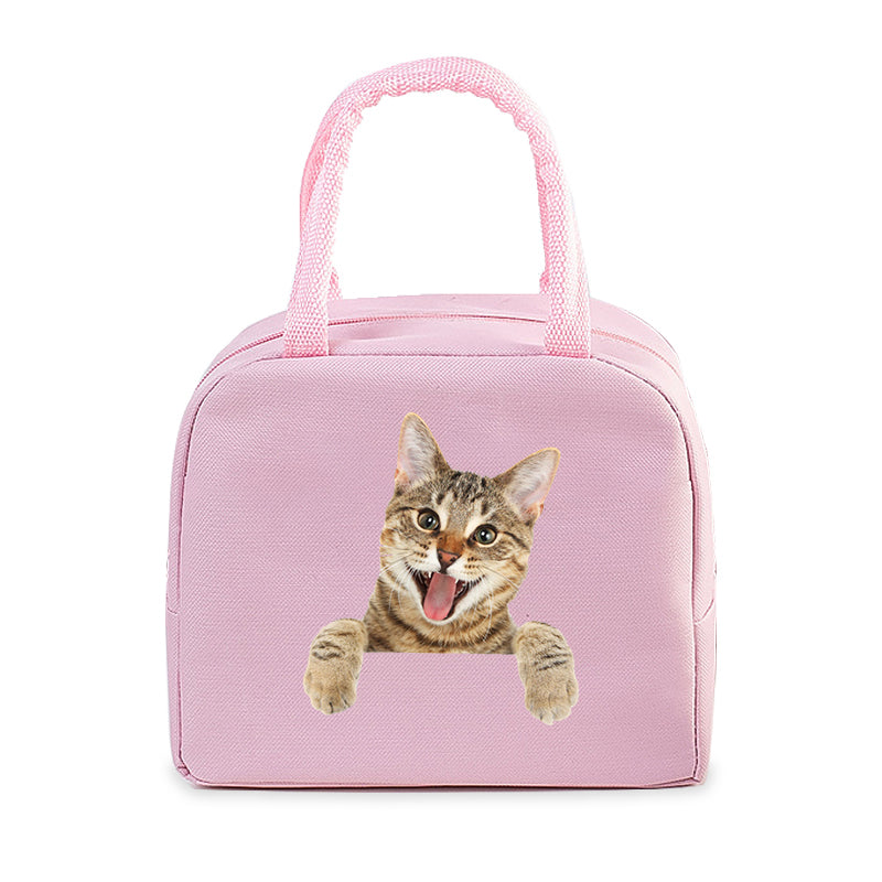 Sac isotherme pour chats en rose avec une image d'un chat souriant, idéal pour transporter les aliments et les friandises.