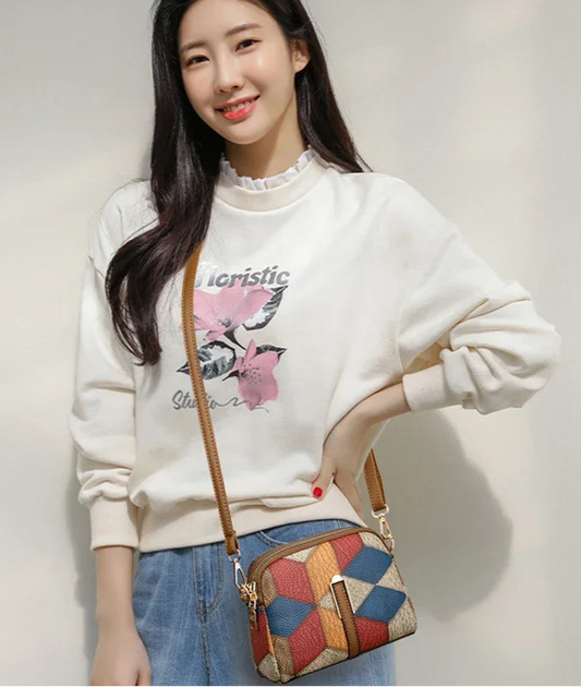 Sac bandoulière femme au design chic avec motifs géométriques colorés, accessoire mode femme chic idéal