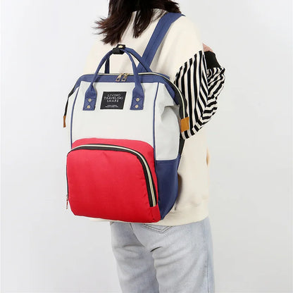 Sac isotherme maman bebe pratique et élégant, en bleu, rouge et blanc, parfait pour les sorties avec bébé