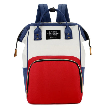 Sac isotherme maman bebe élégant en bleu et rouge, idéal pour garder les aliments au frais lors de sorties avec bébé