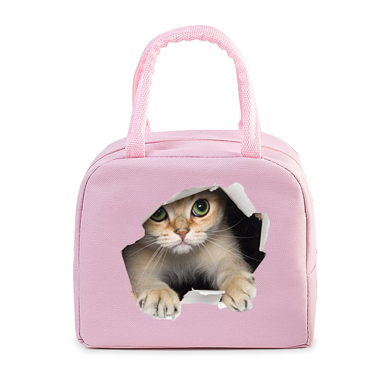 Sac isotherme pour chats en rose avec ouverture et pelage d'un chat curieux à travers l'axe