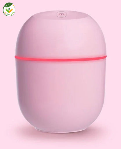 Diffuseur huiles essentielles rose élégant avec une lumière douce, idéal pour créer une atmosphère relaxante à la maison