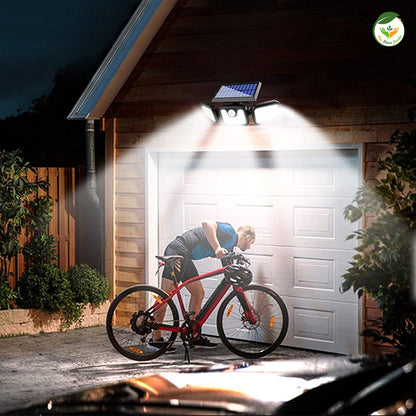 Lampes de jardin design illuminant l'extérieur moderne, mettant en valeur un homme réparant son vélo sous une lumière solaire