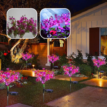 Lampe solaire décorative à fleurs roses illuminant le jardin, parfait pour l'eclairage solaire pour decoration de jardin